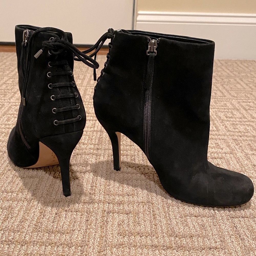Black suede heeled booties with lace up detail